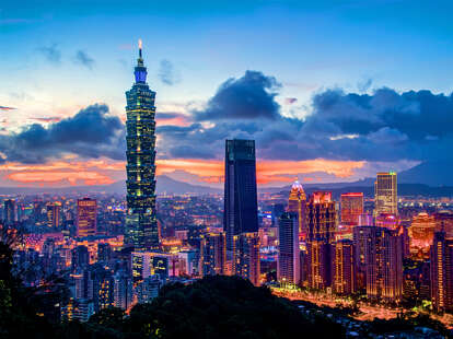 Taipei 101 is a landmark and the tallest building in Taiwan, shown at sunset