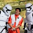 Frightened man surrounded by Stormtroopers at Disney World